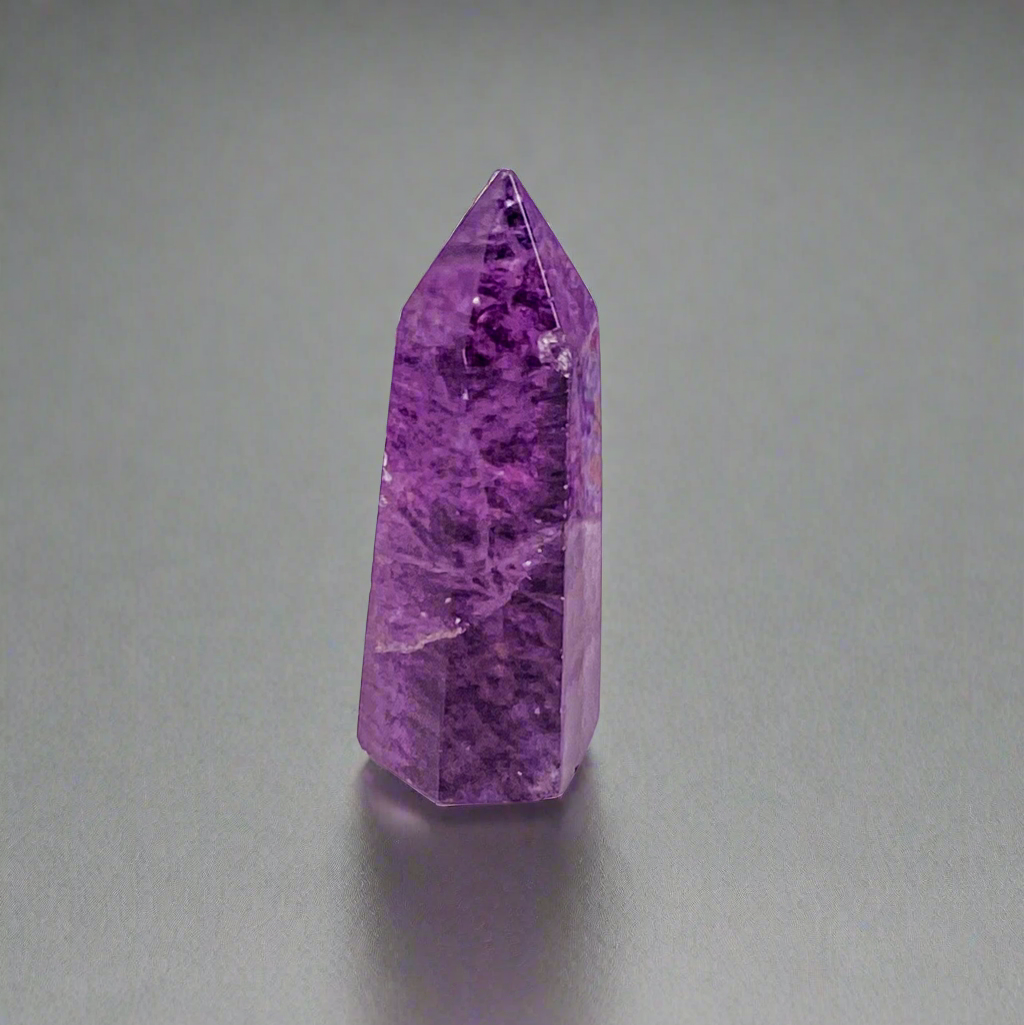 Amethyst vivid purple point with swirls 