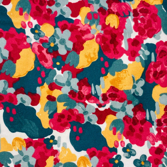 Bright abstract floral with coral reds and pink, soft yellow and an array of teals. 