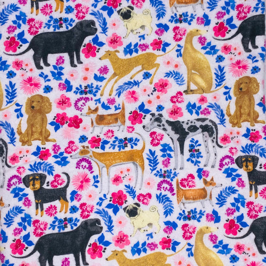 dogs of all kinds brown, black and tan with pink and blue floral background 