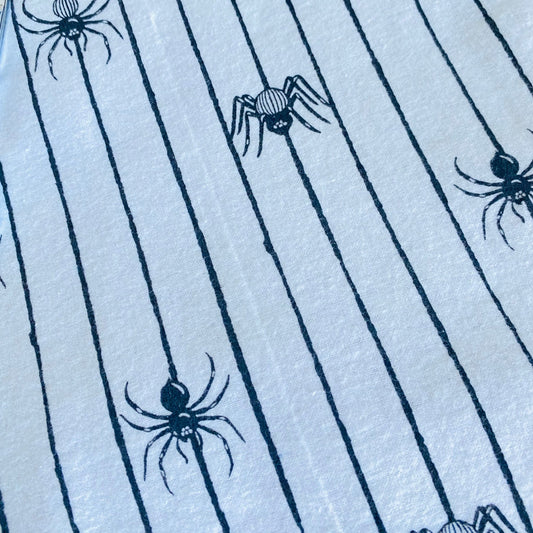 Multiple spider types in black and white on black and white stripped background